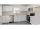 Modern kitchen featuring white cabinets and stainless steel appliances at 7124 Brynhurst Dr, Charlotte, NC 28210