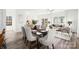 Bright dining area adjacent to the living room with a modern glass table, perfect for Gathering meals and gatherings at 743 Separk Cir, Gastonia, NC 28054
