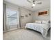 Bright bedroom with a ceiling fan and large window at 8310 Sandstone Crest Ln, Indian Land, SC 29707
