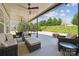 A beautifully covered patio with outdoor seating and dining options, offering great outdoor entertaining at 8310 Sandstone Crest Ln, Indian Land, SC 29707