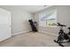 Bright exercise room with a window, fitness equipment at 8310 Sandstone Crest Ln, Indian Land, SC 29707