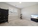 Bright exercise room with a window, fitness equipment and a tv at 8310 Sandstone Crest Ln, Indian Land, SC 29707