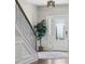 Welcoming foyer with hardwood floors, staircase, and decorative front door at 8310 Sandstone Crest Ln, Indian Land, SC 29707