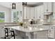 Bright kitchen with white cabinetry, subway tile backsplash, quartz countertop, and modern pendant lighting at 8310 Sandstone Crest Ln, Indian Land, SC 29707