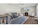 Comfortable living room with a gray sectional sofa, fireplace, and TV, creating a cozy and inviting atmosphere at 8310 Sandstone Crest Ln, Indian Land, SC 29707