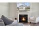 Inviting living room features a fireplace and television displaying the home's exterior at 8310 Sandstone Crest Ln, Indian Land, SC 29707