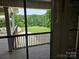 Beautiful backyard featuring a well-manicured lawn, mature trees, and a tranquil pond, perfect for relaxation at 1030 Hurley School Rd, Salisbury, NC 28147