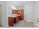 Bathroom features a long vanity with sink, matching wood cabinets for linen, and wood-look tile flooring at 1030 Hurley School Rd, Salisbury, NC 28147