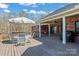 Deck with a table, chairs, and a grill, offering a perfect outdoor dining space at 1030 Hurley School Rd, Salisbury, NC 28147