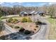 Charming single-story home featuring a landscaped yard and circular driveway at 1030 Hurley School Rd, Salisbury, NC 28147