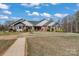 Wide front yard with walkway to the home's front door and lush, mature landscaping at 1030 Hurley School Rd, Salisbury, NC 28147