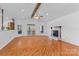 Spacious living room with hardwood floors, fireplace, and abundant natural light at 1030 Hurley School Rd, Salisbury, NC 28147