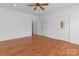 Living room features hardwood floors, neutral walls, and multiple doors at 1030 Hurley School Rd, Salisbury, NC 28147