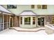 Rear exterior featuring a deck, bay window, brick accents, and a backyard view at 1080 Rolling Green Dr, Newton, NC 28658