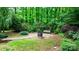 Beautiful backyard with a swing, mature trees, and a serene, private setting at 1080 Rolling Green Dr, Newton, NC 28658