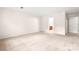 Spacious bedroom with carpet and a view into the attached bathroom at 1080 Rolling Green Dr, Newton, NC 28658