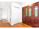 Elegant foyer with hardwood floors and a decorative front door with sidelights at 1080 Rolling Green Dr, Newton, NC 28658