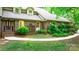 Beautiful brick home with manicured landscaping and charming details, creating an inviting and picturesque facade at 1080 Rolling Green Dr, Newton, NC 28658