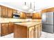 Traditional kitchen featuring a large island, stainless steel appliances, and ample cabinet space, perfect for cooking at 1080 Rolling Green Dr, Newton, NC 28658