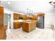 Well-appointed kitchen with a functional island, modern appliances, and tile floors, creating a cozy cooking space at 1080 Rolling Green Dr, Newton, NC 28658