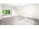 Spacious living room with chandelier and large windows offering plenty of natural light at 1080 Rolling Green Dr, Newton, NC 28658