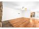 Bright and spacious living room with hardwood floors and a stone fireplace, offering a cozy and inviting atmosphere at 1080 Rolling Green Dr, Newton, NC 28658