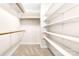 Spacious walk-in closet featuring ample shelving and hanging rods at 1080 Rolling Green Dr, Newton, NC 28658