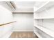 Well-organized walk-in closet featuring ample shelving and rods at 1080 Rolling Green Dr, Newton, NC 28658