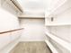 Organized walk-in closet with multiple shelves and clothes rods at 1080 Rolling Green Dr, Newton, NC 28658