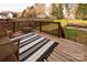 Outdoor deck with a striped rug and cushioned seating, perfect for relaxation and entertainment at 10845 Hellebore Rd, Charlotte, NC 28213