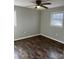 Bedroom featuring wood-look floors, modern ceiling fan, and natural light at 1105 Carnation Ln, Sharon, SC 29742
