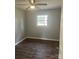 Comfortable bedroom featuring wood-look floors, a window, and neutral-colored walls at 1105 Carnation Ln, Sharon, SC 29742
