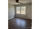 Cozy room featuring wood-look floors, a bright window, and a neutral color scheme at 1105 Carnation Ln, Sharon, SC 29742