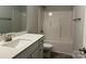 Bathroom featuring white cabinets, quartz countertops, shower, and toilet at 111 High Rock Ct # 10, Statesville, NC 28677