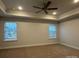 Spacious primary bedroom featuring a ceiling fan and natural lighting at 111 High Rock Ct # 10, Statesville, NC 28677