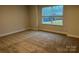 Bedroom with carpet, neutral colors, and a window with blinds at 111 High Rock Ct # 10, Statesville, NC 28677