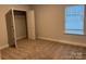 Bedroom featuring carpeting, closet and window with blinds at 111 High Rock Ct # 10, Statesville, NC 28677