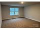 A cozy bedroom featuring neutral walls and plush carpeting at 111 High Rock Ct # 10, Statesville, NC 28677