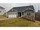 Charming single-story home with stone accents, a two-car garage, and well-manicured lawn at 111 High Rock Ct # 10, Statesville, NC 28677