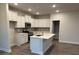 Modern kitchen featuring white cabinets, stainless steel appliances, and center island at 111 High Rock Ct # 10, Statesville, NC 28677