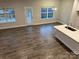 Bright living room boasts hardwood floors, natural light, and modern finishes at 111 High Rock Ct # 10, Statesville, NC 28677
