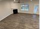 Spacious living room with a fireplace and an outdoor patio at 111 High Rock Ct # 10, Statesville, NC 28677