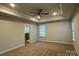 Large main bedroom showing the carpet, tray ceilings, and ensuite bathroom at 111 High Rock Ct # 10, Statesville, NC 28677
