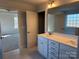 Bright bathroom featuring a double vanity and ample natural light at 121 High Rock Ct # 08, Statesville, NC 28677