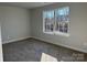 Comfortable bedroom with plush carpeting and a window offering plenty of natural light at 121 High Rock Ct # 08, Statesville, NC 28677