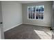 Comfortable bedroom with plush carpeting, a window view, and neutral wall color at 121 High Rock Ct # 08, Statesville, NC 28677