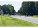 The entrance gate to the neighborhood is marked by a gate with signage and a guard rail at 121 High Rock Ct # 08, Statesville, NC 28677
