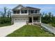 Charming two-story home features a two-car garage, covered front porch, and manicured lawn at 121 High Rock Ct # 08, Statesville, NC 28677