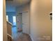 Upstairs hallway with carpeted floors, neutral paint, and doorways leading to other rooms at 121 High Rock Ct # 08, Statesville, NC 28677