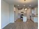 Open-concept kitchen with a large island, white cabinets and modern appliances at 121 High Rock Ct # 08, Statesville, NC 28677